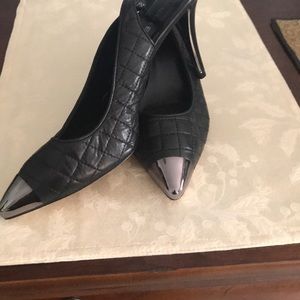 Van Eli calf skin, quilted sling back heels.